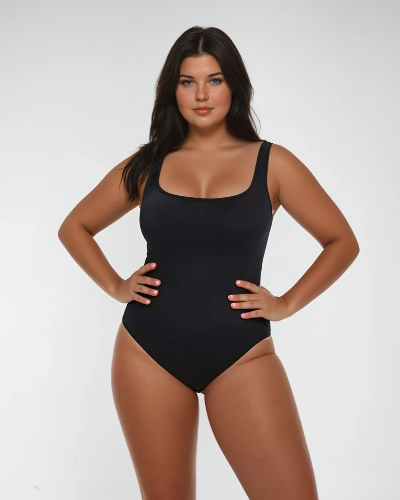 A woman wearing a black square neck ribbed shapewear bodysuit.